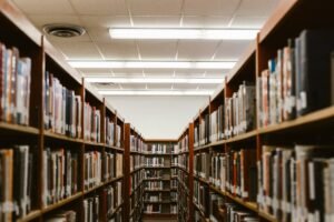 Library bookshelves photographed with shallow depth of field